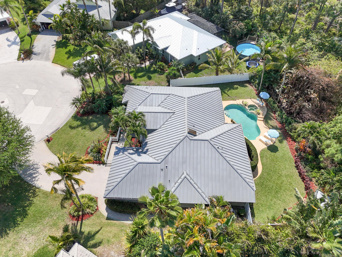 7831 Southeast Windjammer Way Hobe Sound, FL 33455 - Photo 75 of 80 an aerial view of a house with a yard and potted plants