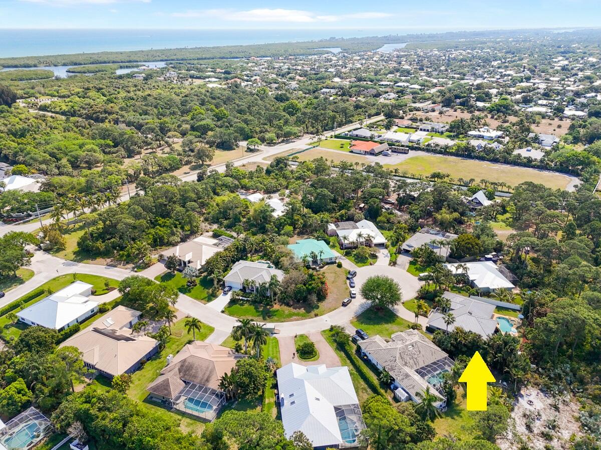 7831 Southeast Windjammer Way Hobe Sound, FL 33455 - Photo 78 of 80 an aerial view of residential houses with outdoor space and swimming pool
