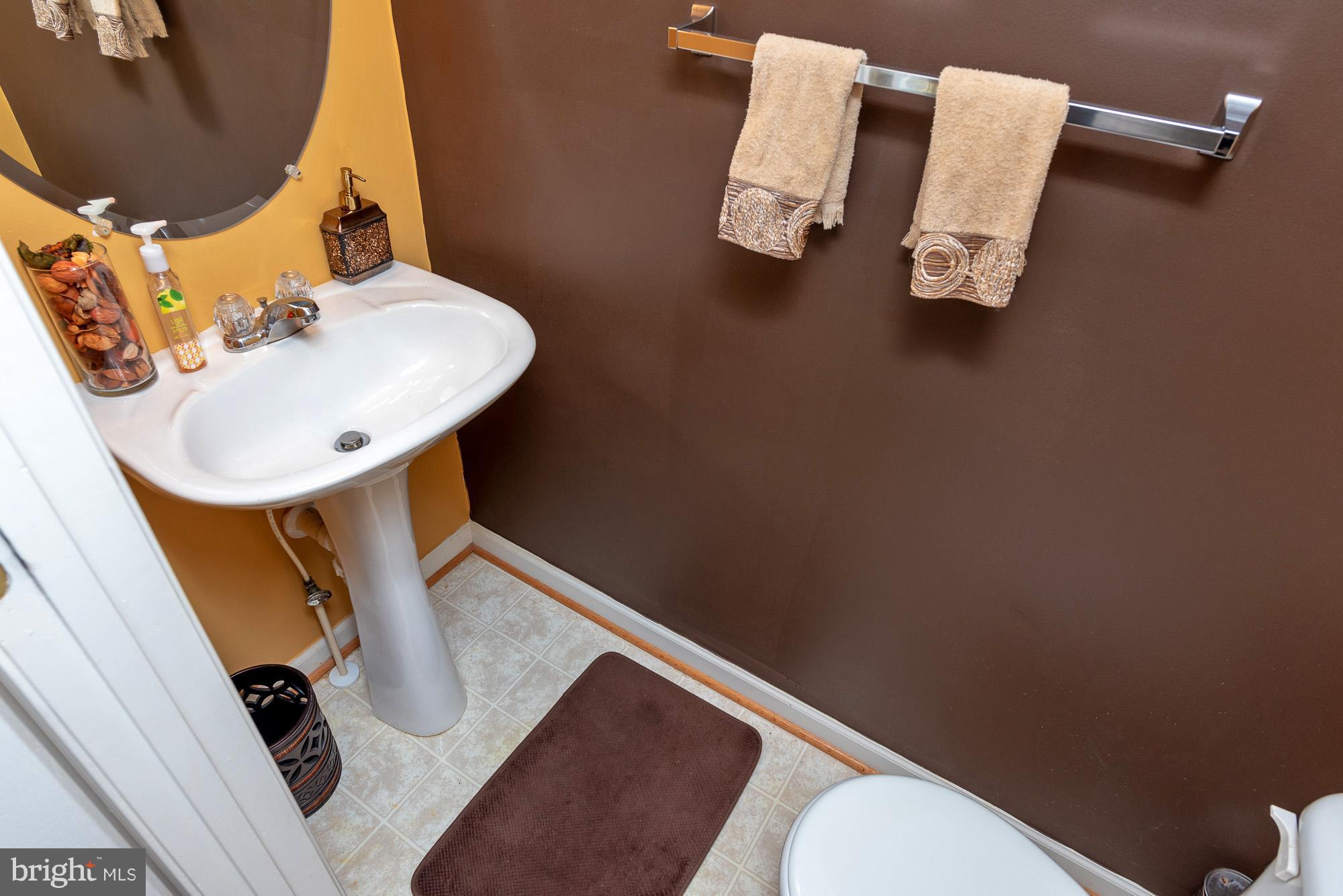 802 Tipton Road Middle River, MD 21220 - Photo 12 of 30 a bathroom with a sink mirror and toilet