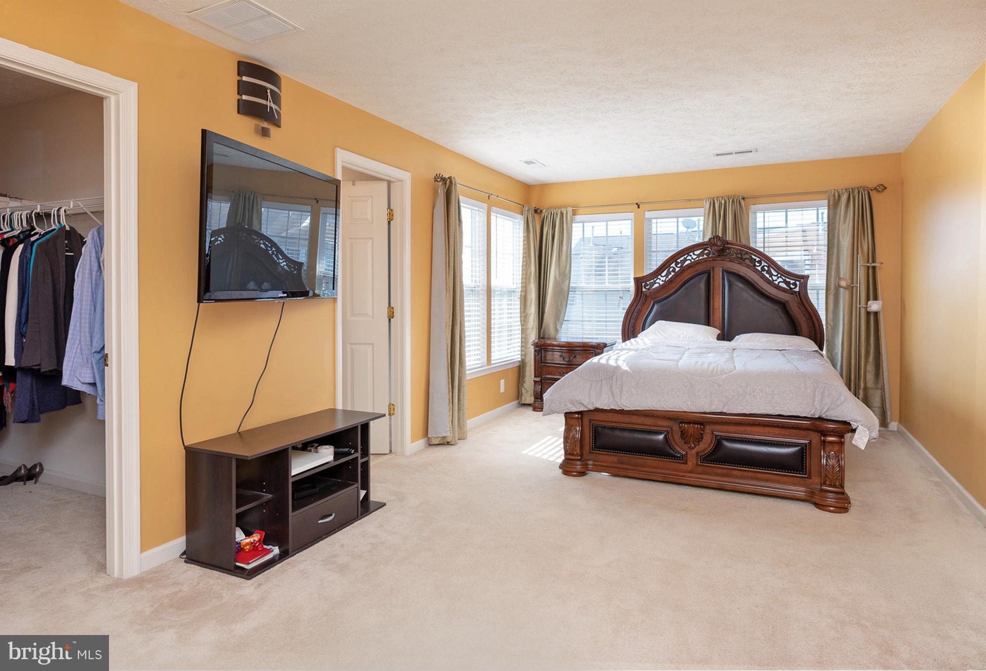 802 Tipton Road Middle River, MD 21220 - Photo 13 of 30 a bedroom with furniture and a flat tv screen