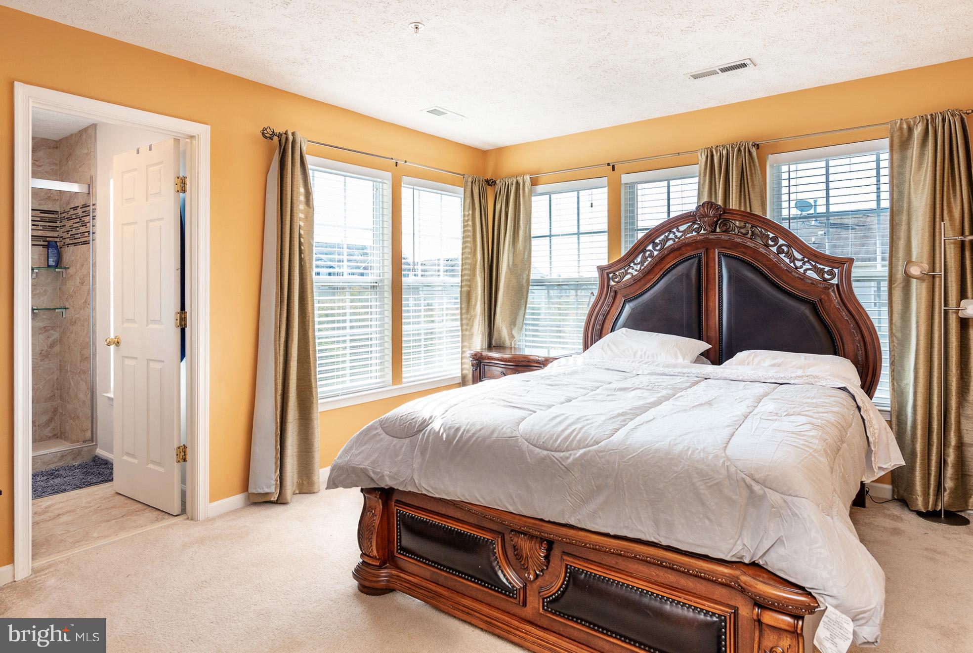 802 Tipton Road Middle River, MD 21220 - Photo 14 of 30 a bedroom with a bed and a large window