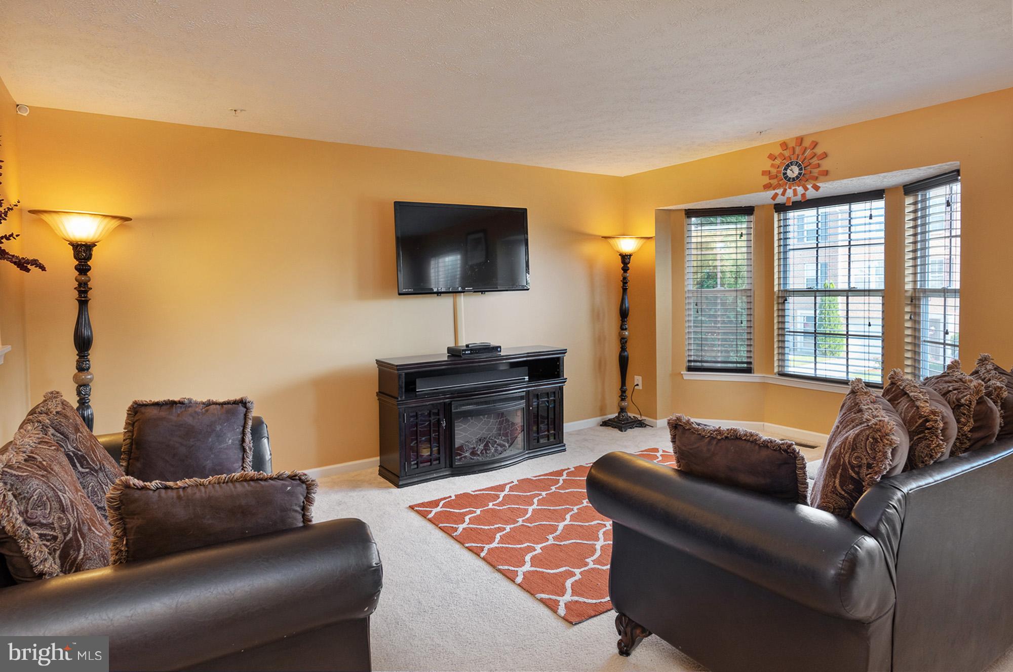 802 Tipton Road Middle River, MD 21220 - Photo 3 of 30 a living room with furniture and a flat screen tv