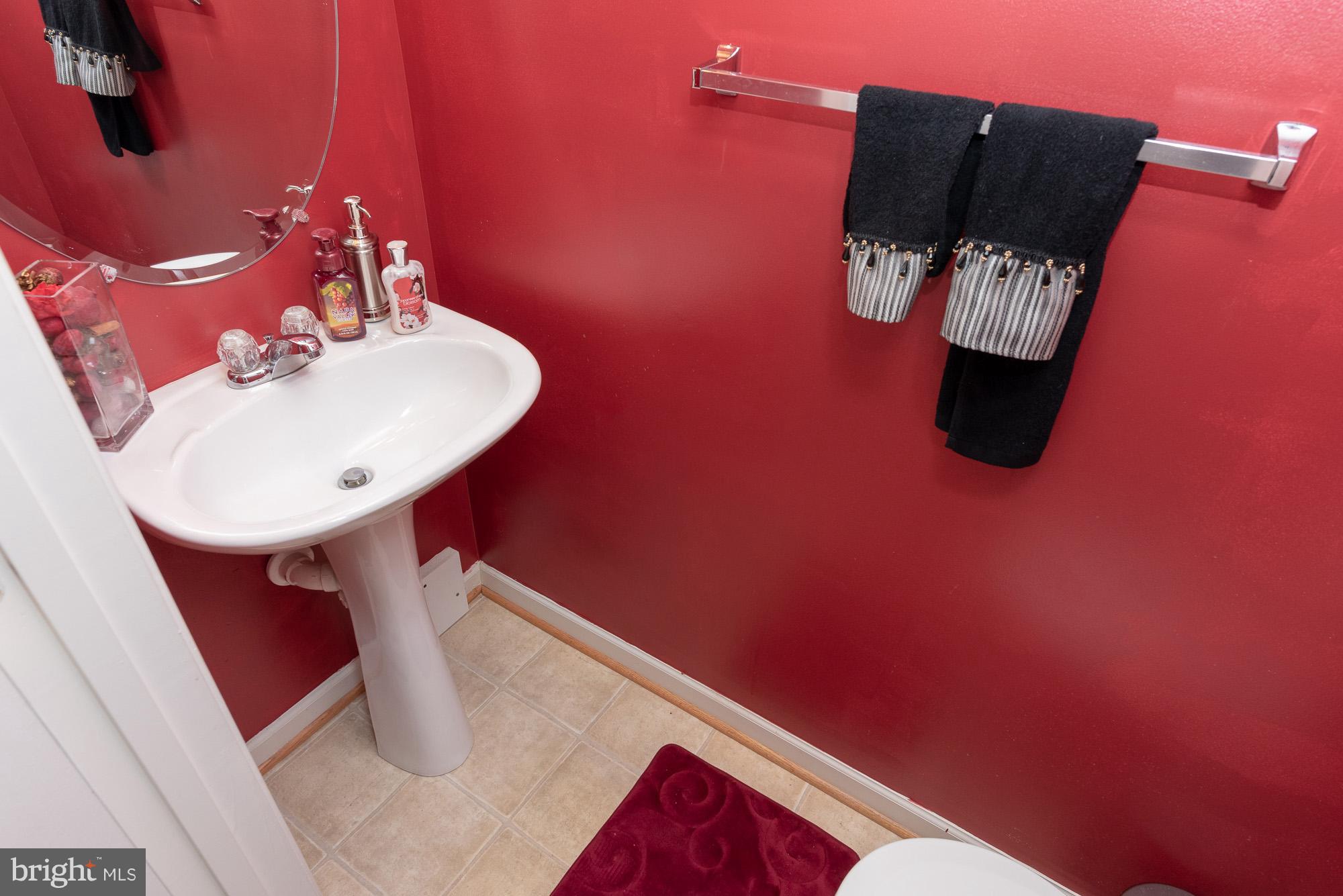 802 Tipton Road Middle River, MD 21220 - Photo 24 of 30 a bathroom with a sink and mirror