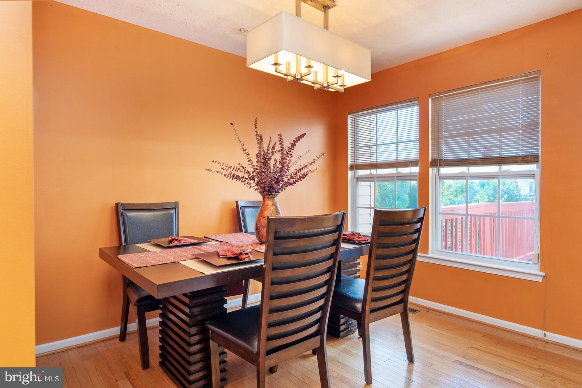 802 Tipton Road Middle River, MD 21220 - Photo 9 of 30 a view of a dining room with furniture window and wooden floor