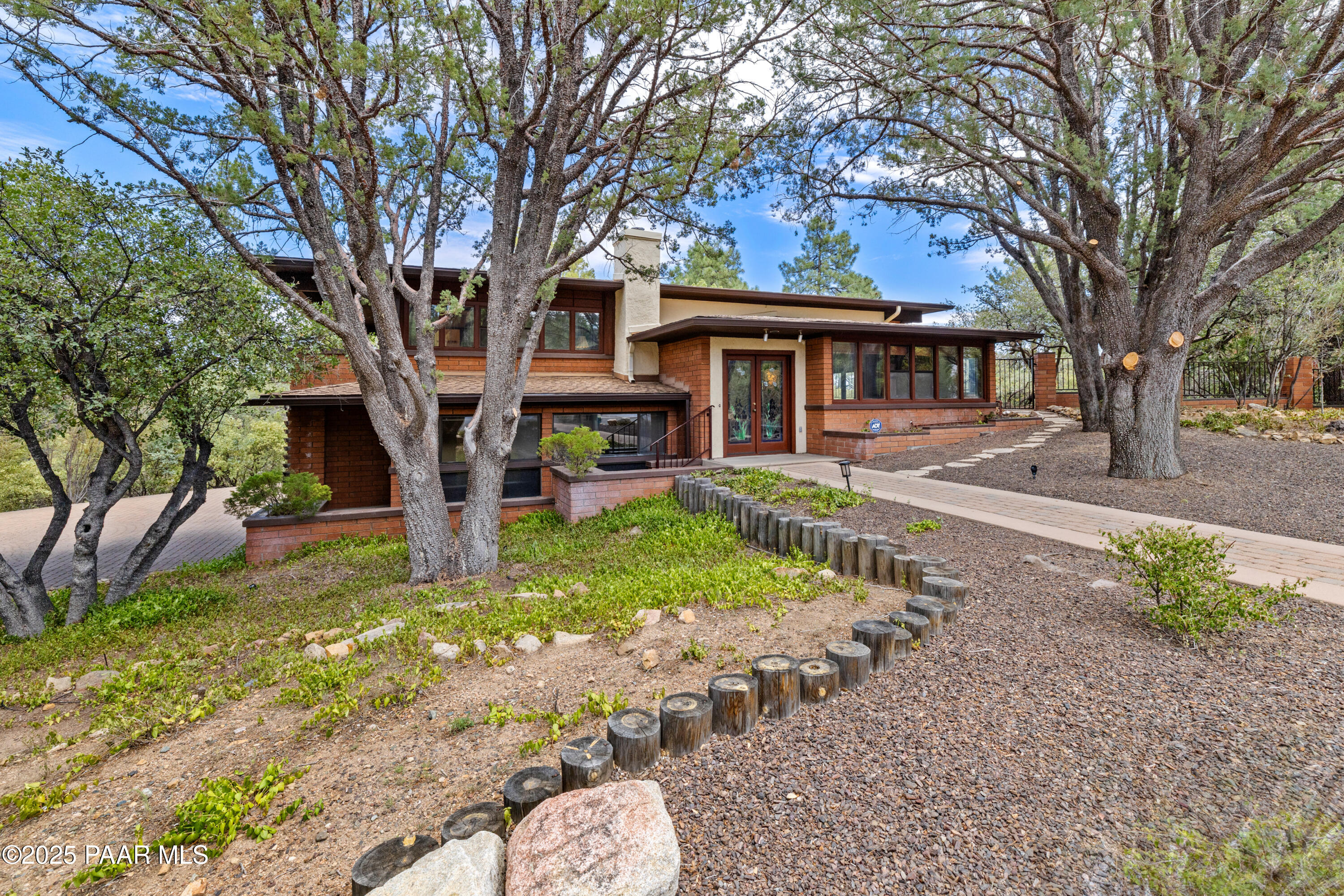 a front view of a house with garden