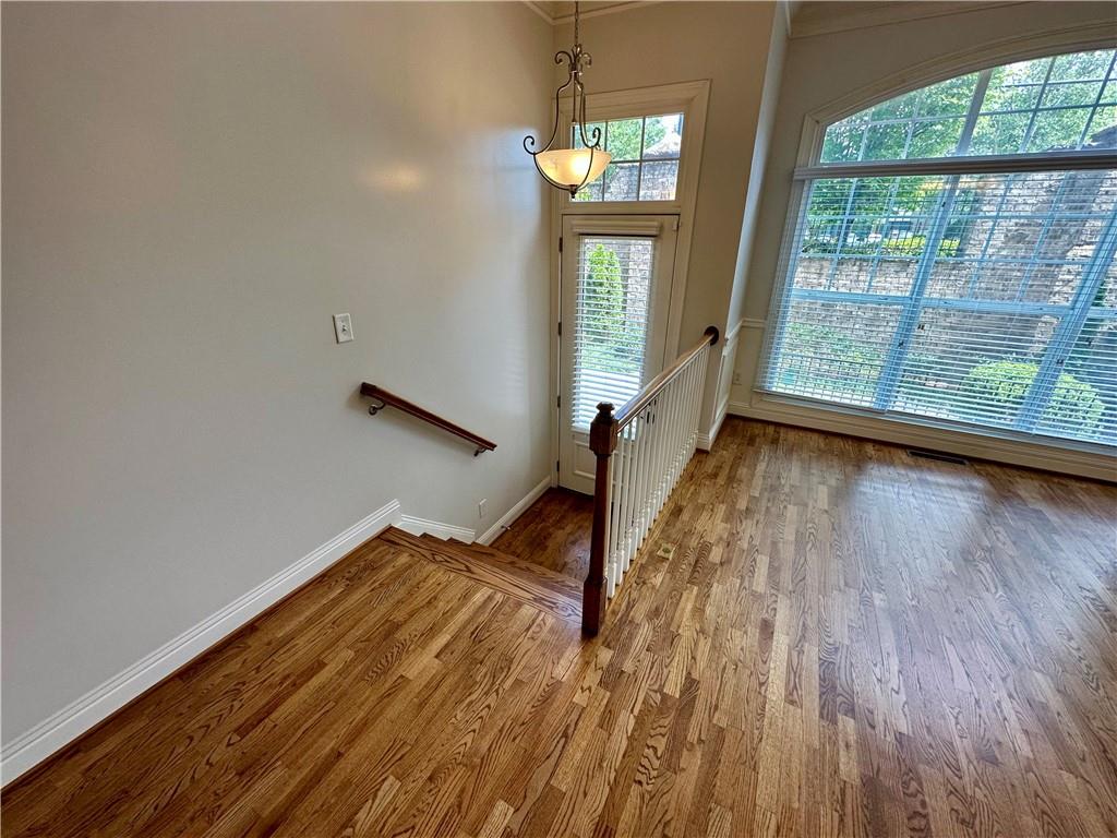 1615 Rivers Edge Trail Northeast Atlanta, GA 30324 - Photo 6 of 26 a view of empty room with wooden floor and fan