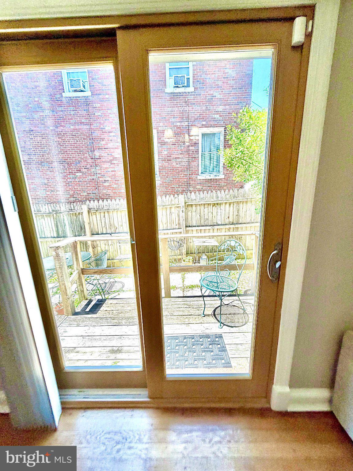 19 Hamilton Street Northeast, Unit 1 Washington, DC 20011 - Photo 4 of 17 Sunny patio view through glass doors.