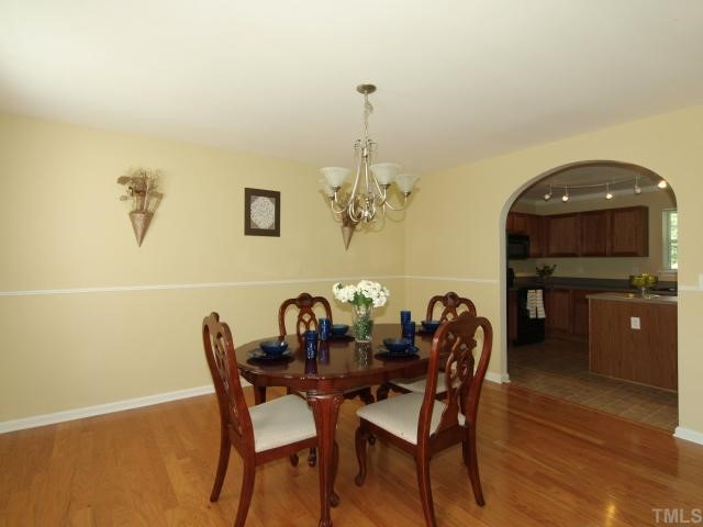 2886 Filbert Street Raleigh, NC 27610 - Photo 2 of 10 Beautiful dining room with gorgeous hardwood floors. Notice the attractive archway leading in to the kitchen.