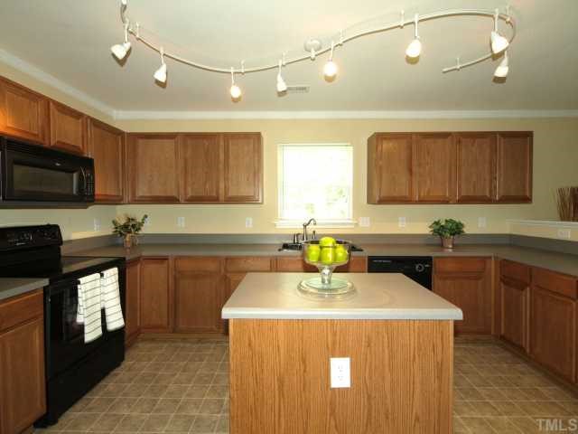 2886 Filbert Street Raleigh, NC 27610 - Photo 3 of 10 This large kitchen with center island is a rare find in this neighborhood. Enjoy tons of cabinets and countertop space.