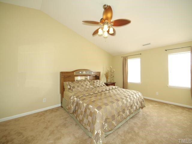 2886 Filbert Street Raleigh, NC 27610 - Photo 4 of 10 What a delightful Owner's Suite with vaulted ceiling, walk in closet, ceiling fan, and private bathroom.