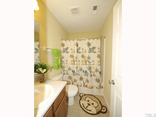 2886 Filbert Street Raleigh, NC 27610 - Photo 9 of 10 The upstairs hall bath has a tub/shower combo.