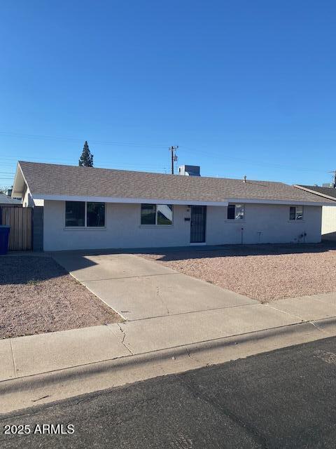 15 East Erie Drive Tempe, AZ 85282 - Photo 1 of 12 a front view of a house with a yard