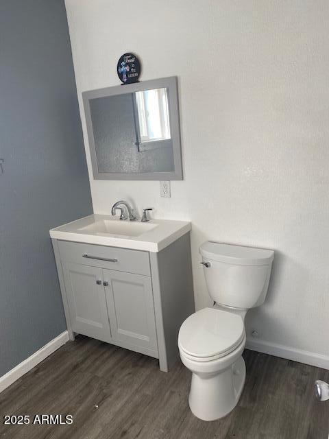 15 East Erie Drive Tempe, AZ 85282 - Photo 11 of 12 a bathroom with a toilet a sink and mirror