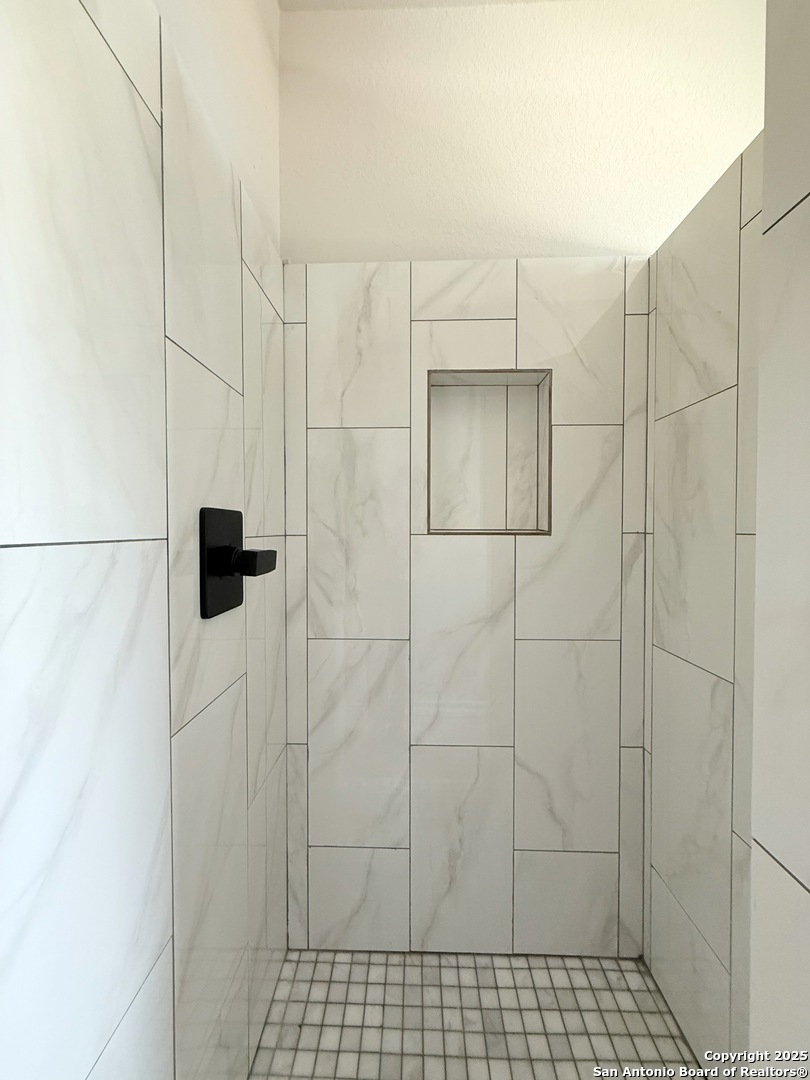 3274 Interstate 35 Natalia, TX 78059 - Photo 14 of 44 a bathroom with a shower