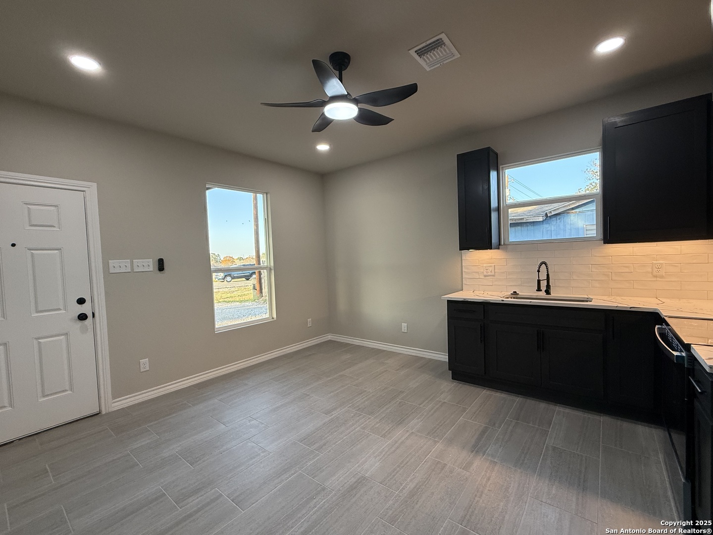 3274 Interstate 35 Natalia, TX 78059 - Photo 23 of 44 a living room with a large bed and a flat screen tv