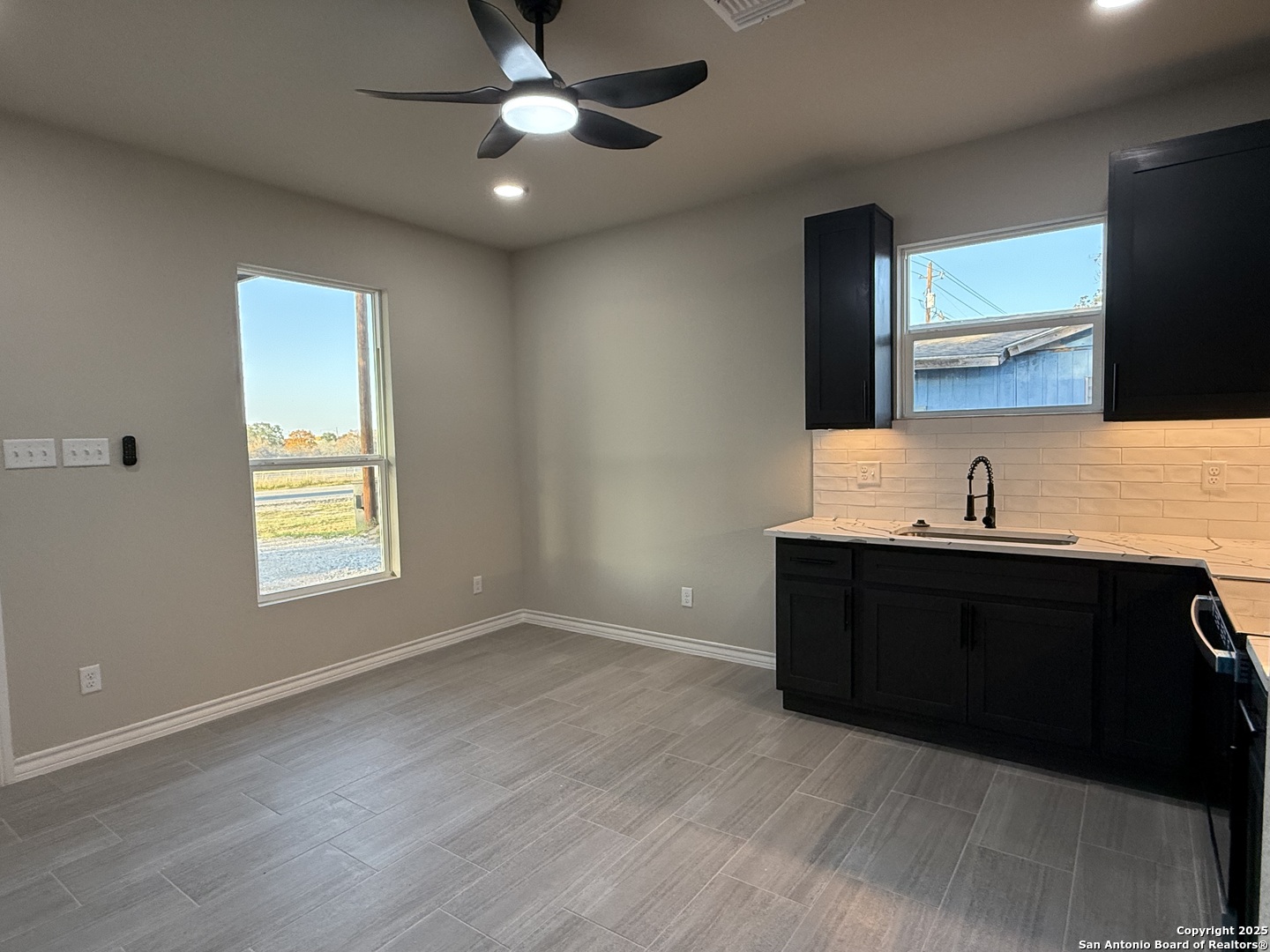 3274 Interstate 35 Natalia, TX 78059 - Photo 24 of 44 a view of an empty room with window and wooden floor