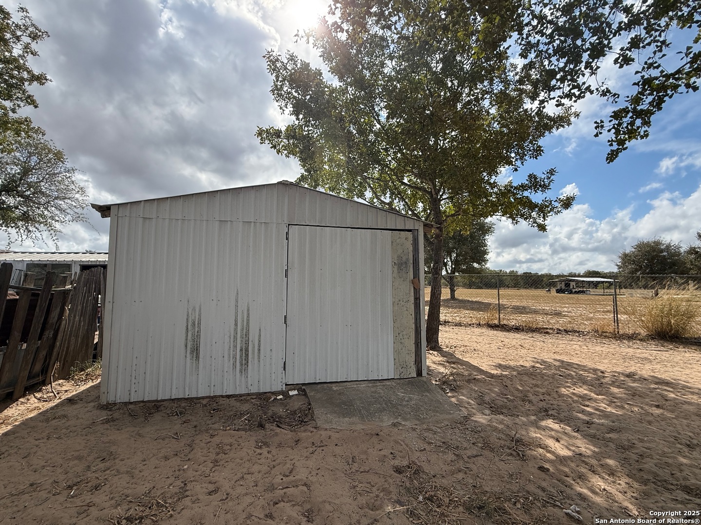 3274 Interstate 35 Natalia, TX 78059 - Photo 33 of 44 a view of backyard and tree