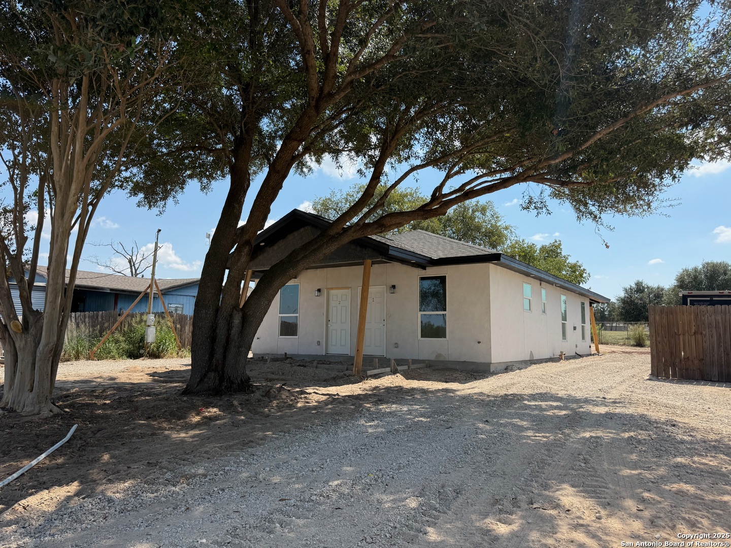 3274 Interstate 35 Natalia, TX 78059 - Photo 37 of 44 a view of a house with a large tree