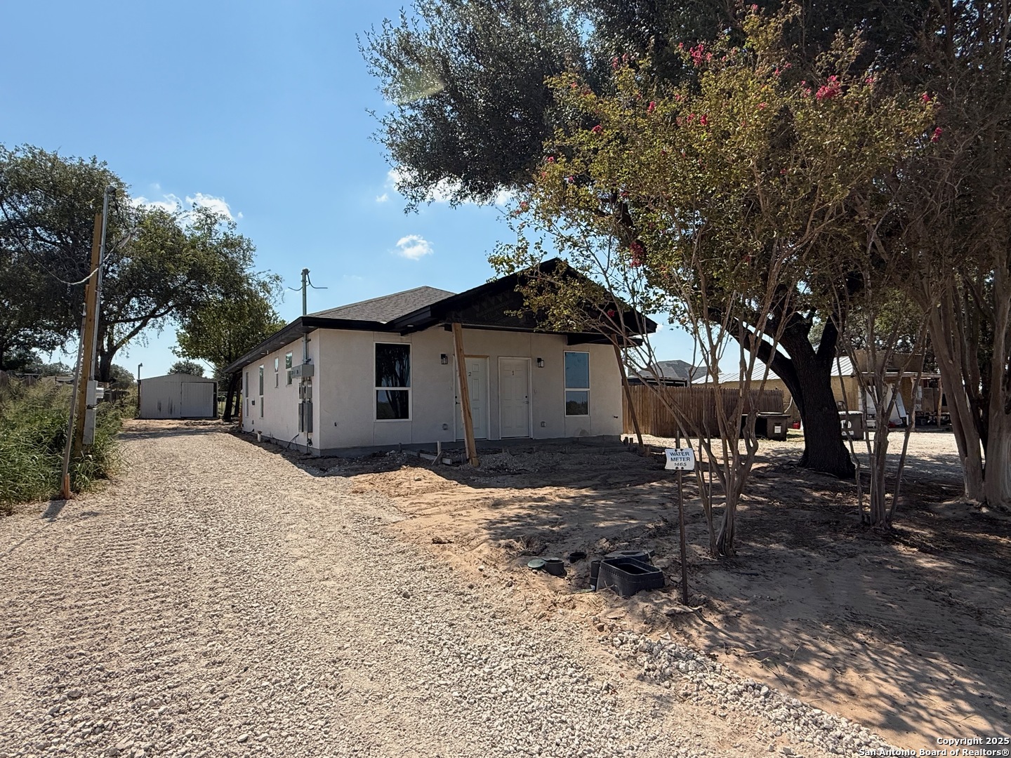 3274 Interstate 35 Natalia, TX 78059 - Photo 38 of 44 a front view of a house with a yard