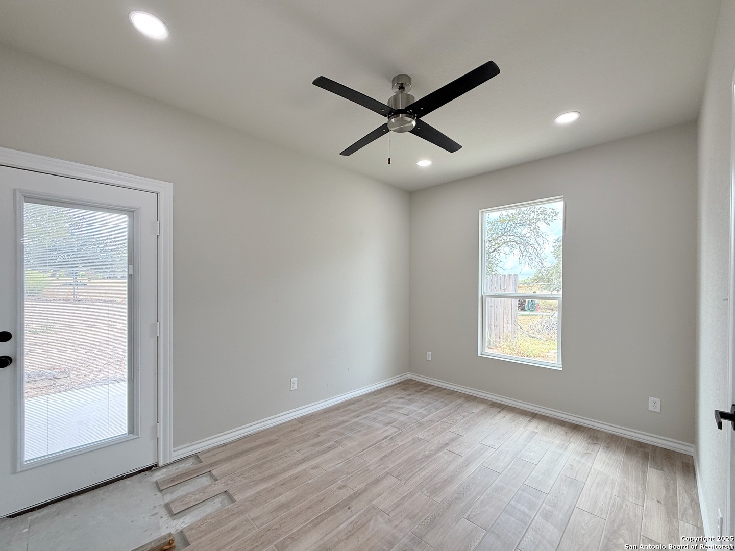 3274 Interstate 35 Natalia, TX 78059 - Photo 10 of 44 a view of a room with wooden floor and windows