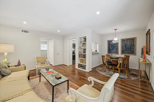 a living room with furniture rug and window