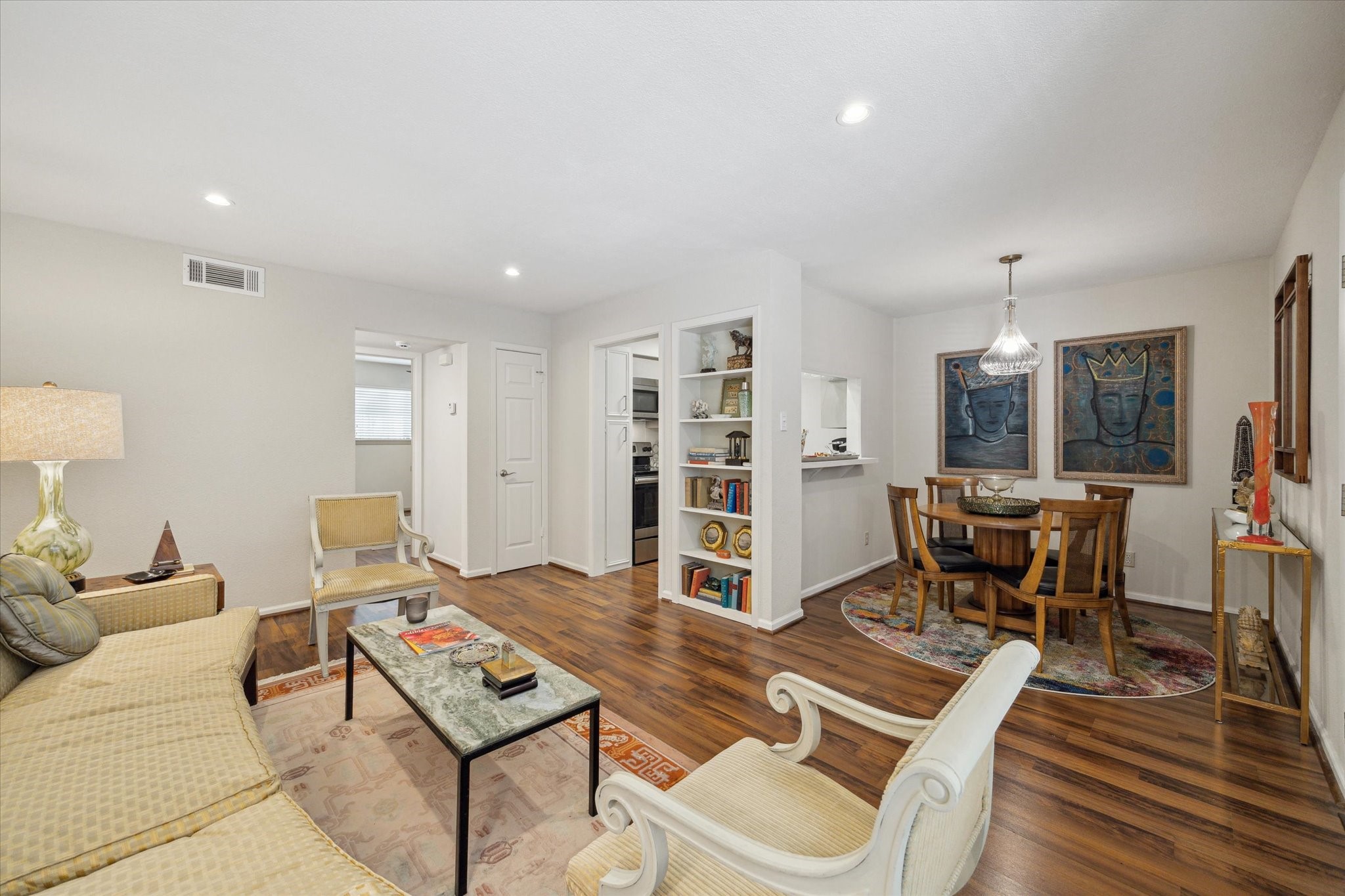 a living room with furniture rug and window