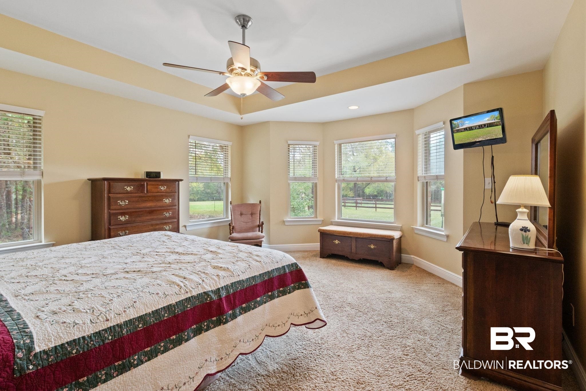 24250 Hack Road Bay Minette, AL 36507 - Photo 27 of 88 Bedroom with a tray ceiling, light colored carpet, a ceiling fan, and recessed lighting