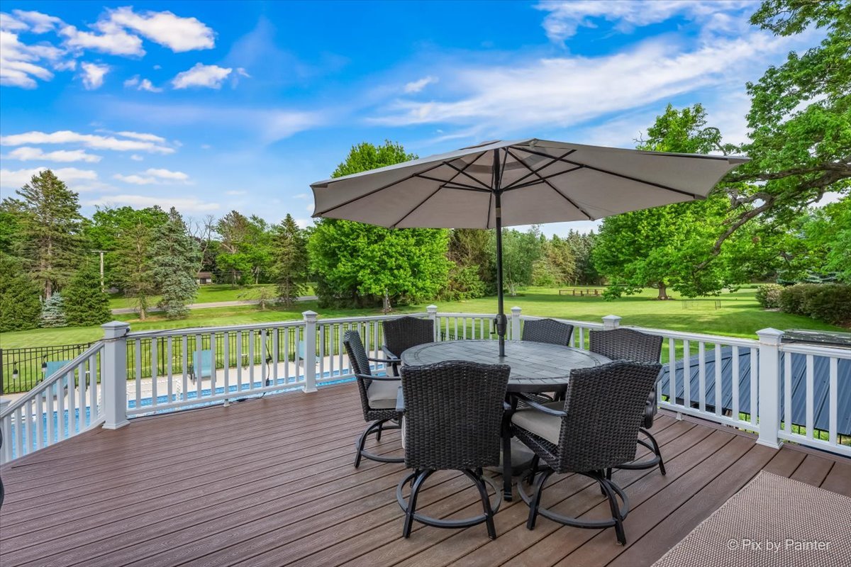 7104 Dove Way Cary, IL 60013 - Photo 56 of 82 a view of a chair and table on the wooden deck