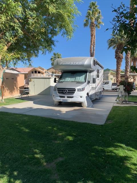 84136 Ave 44, Unit 92 Indio, CA 92203 - Photo 4 of 13 a front view of a house with garden and sitting area