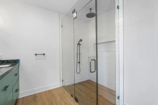 a view of walk in closet with empty racks