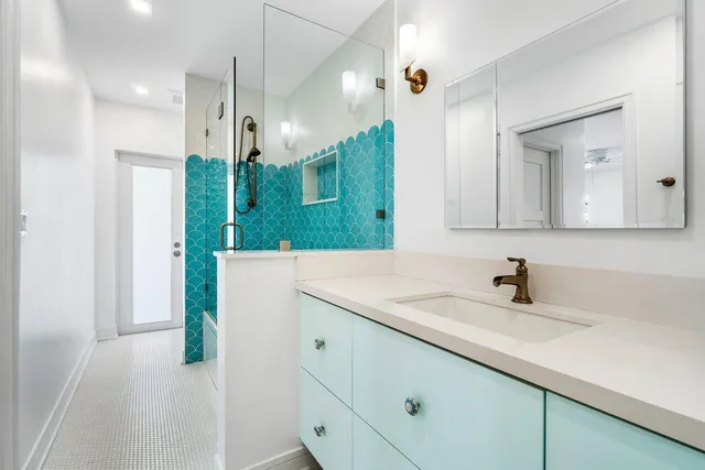 an aerial view of a house with outdoor space pool patio and lake view