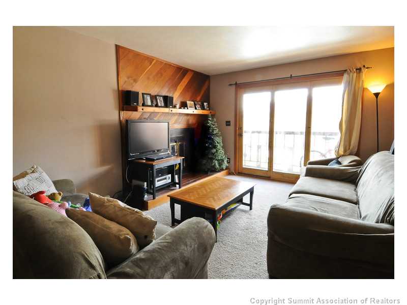 9490 Ryan Gulch Road, Unit 103 Silverthorne, CO 80498 - Photo 3 of 18 Living Room.