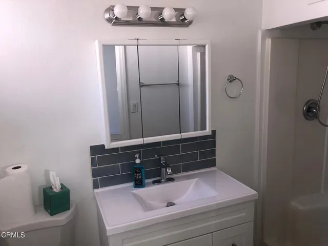 a view of a backyard of the house