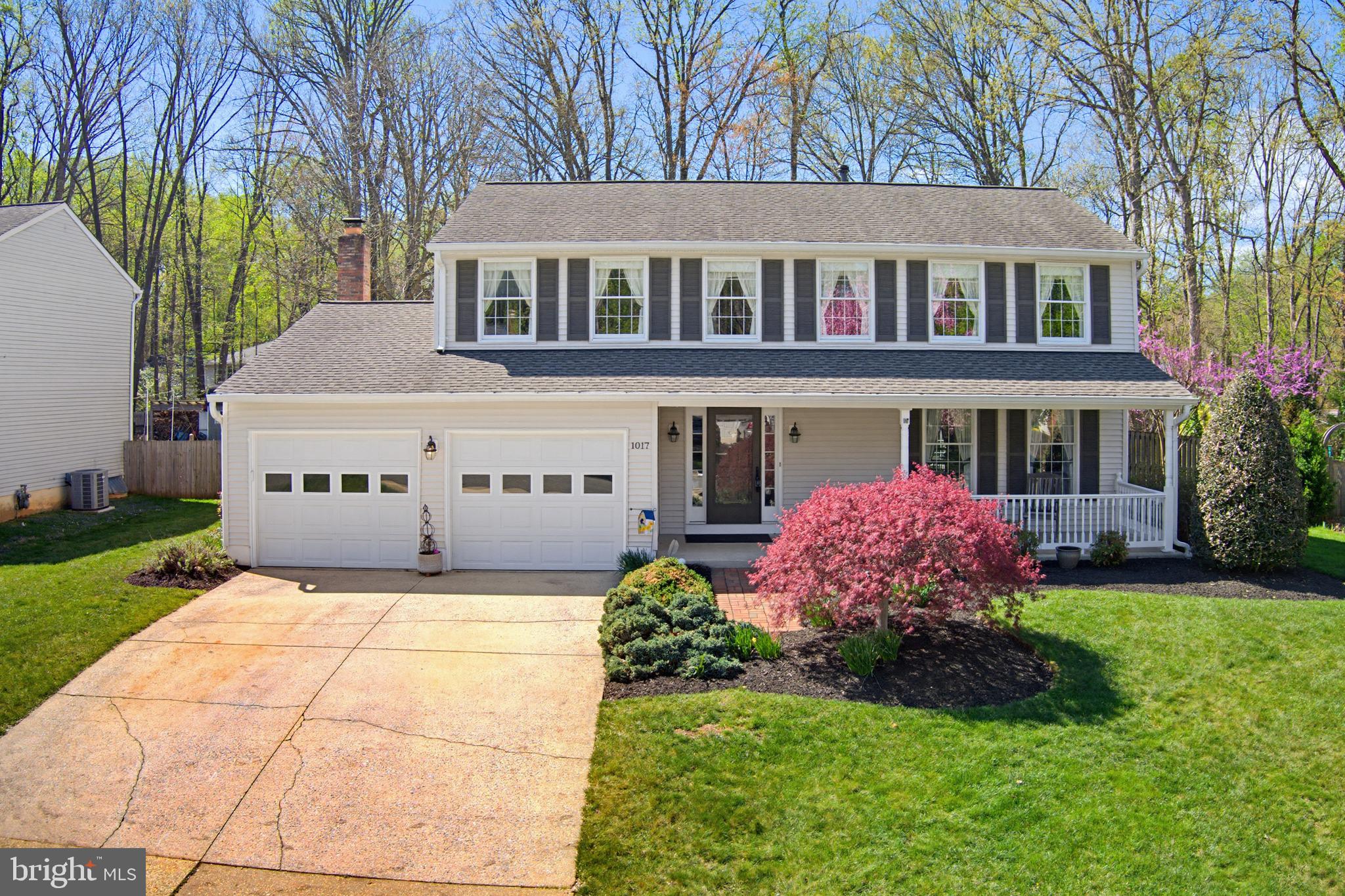 1017 Windmill Lane Silver Spring, MD 20905 - Photo 1 of 57 a front view of a house with garden