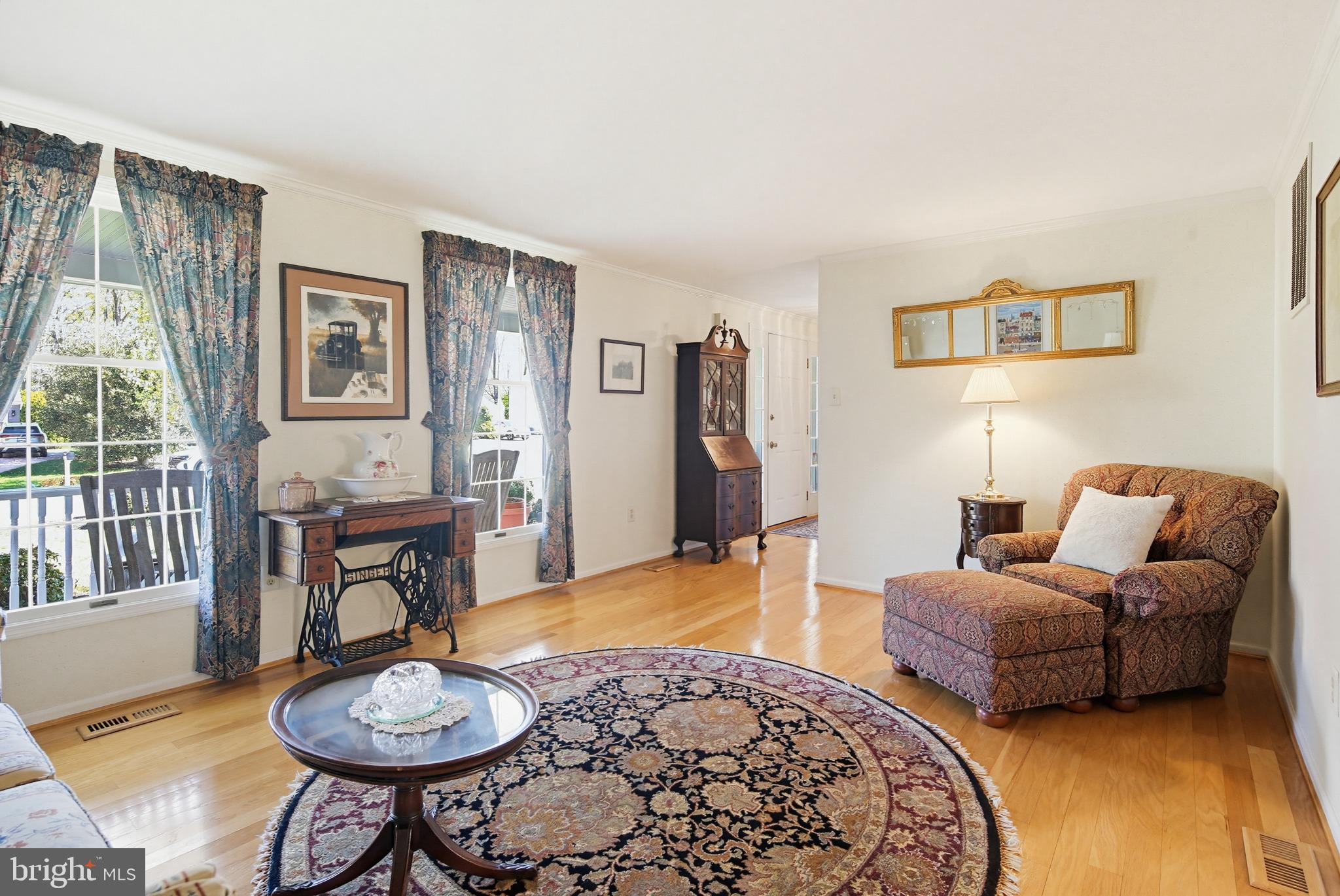 1017 Windmill Lane Silver Spring, MD 20905 - Photo 11 of 57 a living room with furniture a rug and a table