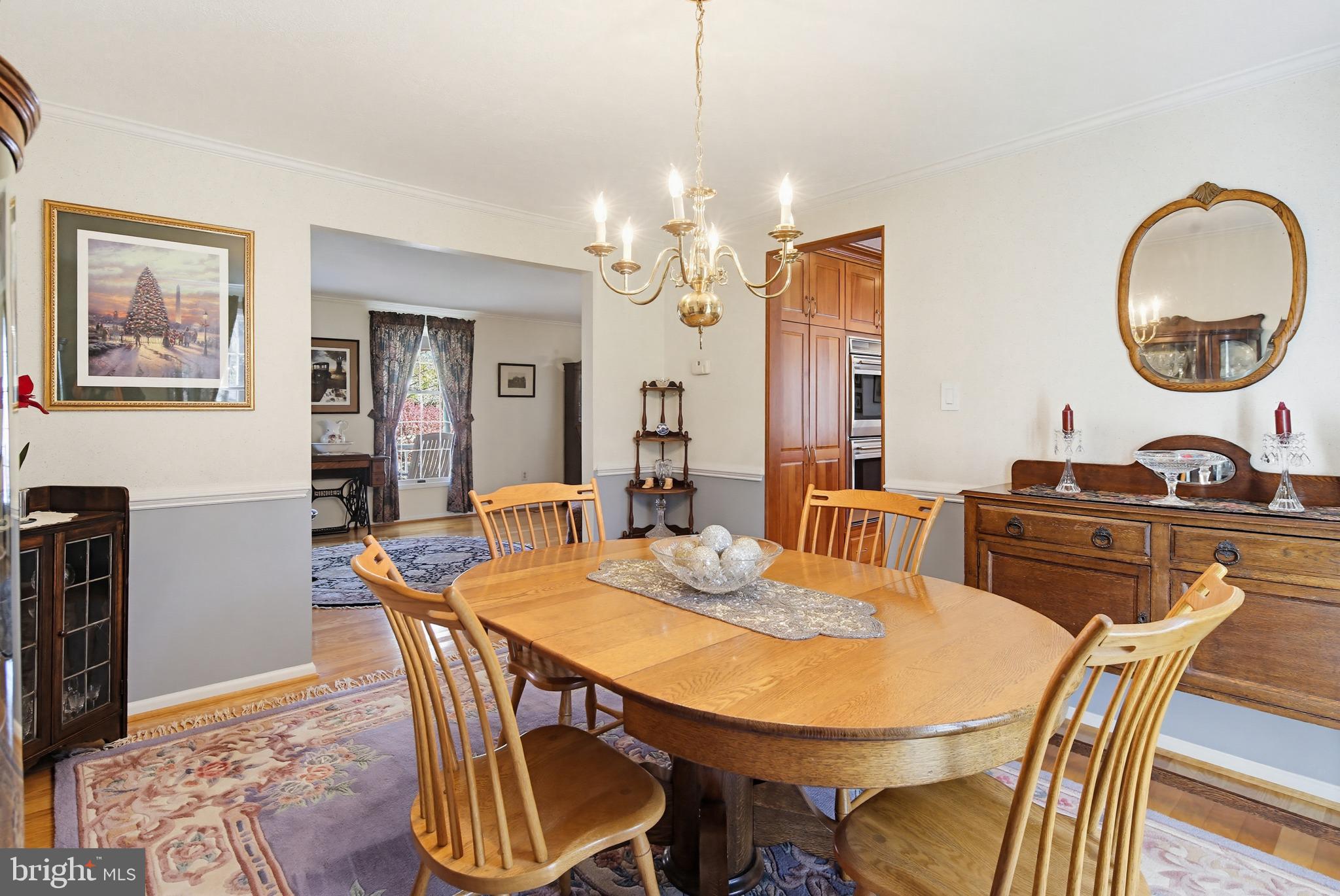1017 Windmill Lane Silver Spring, MD 20905 - Photo 13 of 57 a view of a dining room with furniture and a chandelier