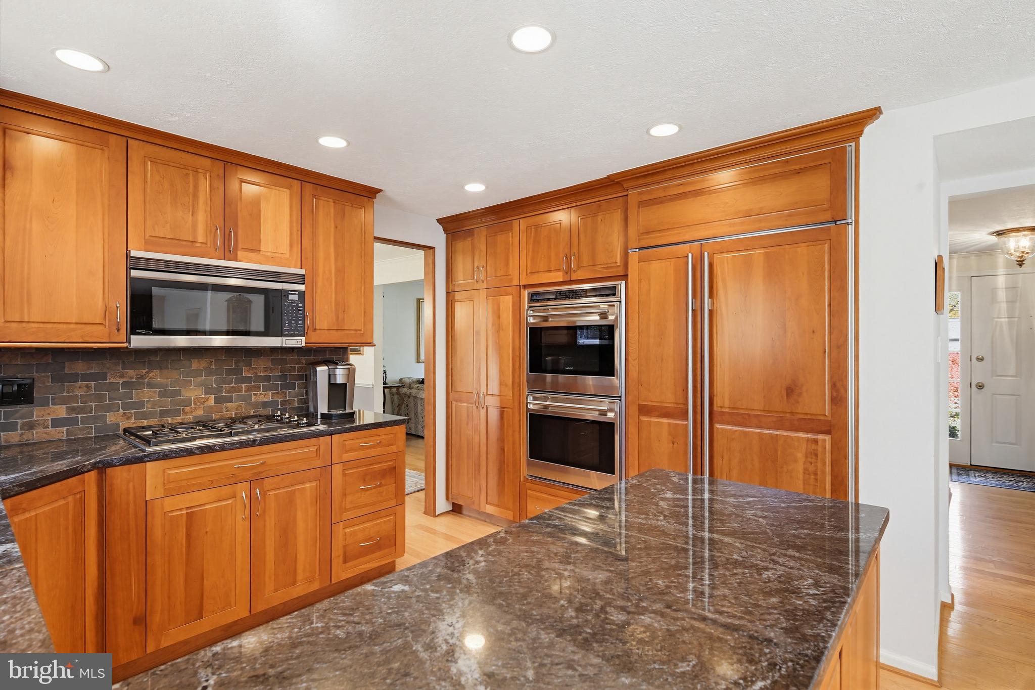 1017 Windmill Lane Silver Spring, MD 20905 - Photo 16 of 57 a kitchen with stainless steel appliances granite countertop a refrigerator and a sink
