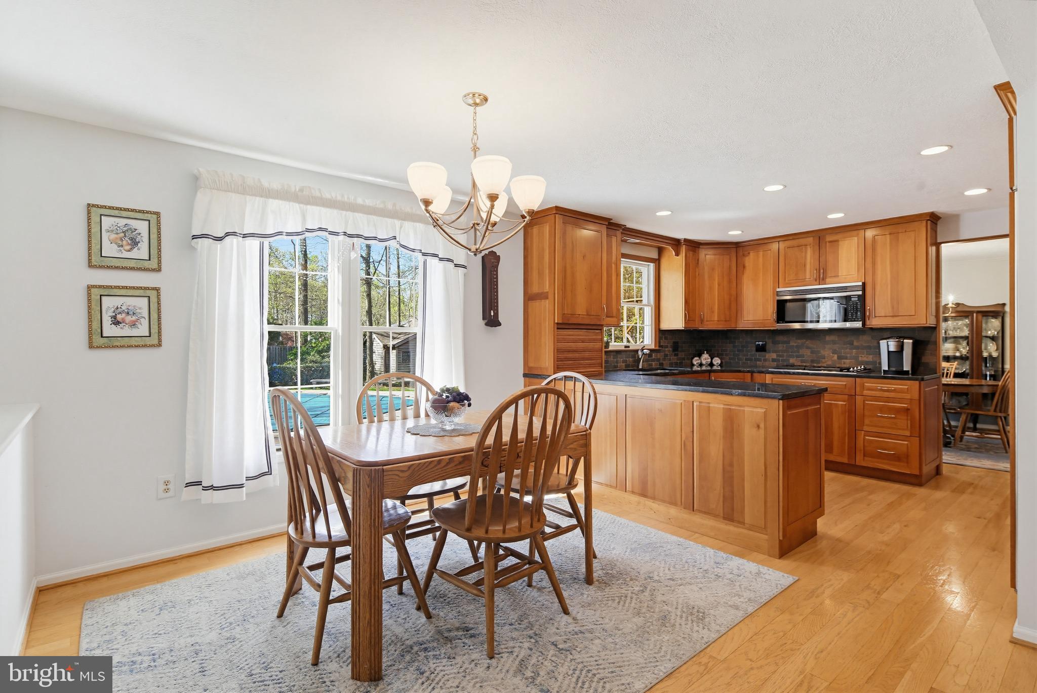 1017 Windmill Lane Silver Spring, MD 20905 - Photo 17 of 57 a view of a dining room with furniture large window and wooden floor