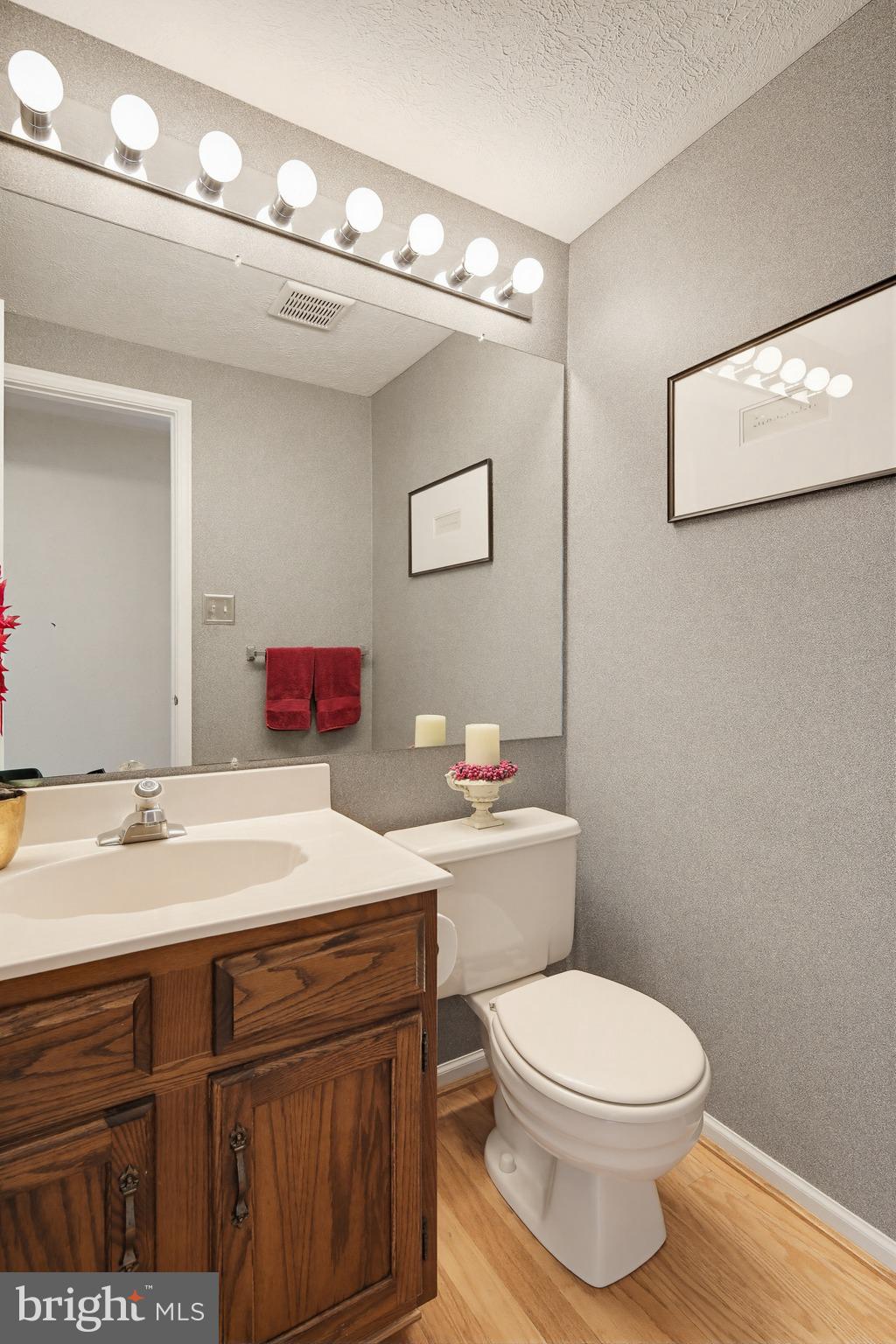 1017 Windmill Lane Silver Spring, MD 20905 - Photo 21 of 57 a bathroom with a toilet a sink and a mirror