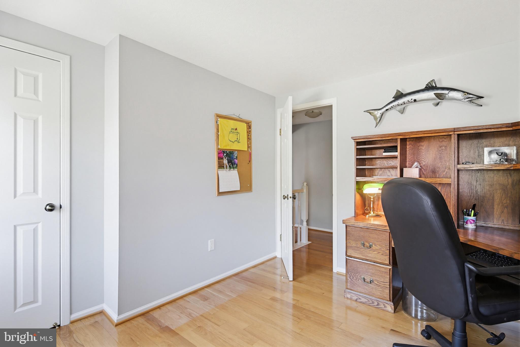 1017 Windmill Lane Silver Spring, MD 20905 - Photo 28 of 57 a view of a workspace with furniture and a window