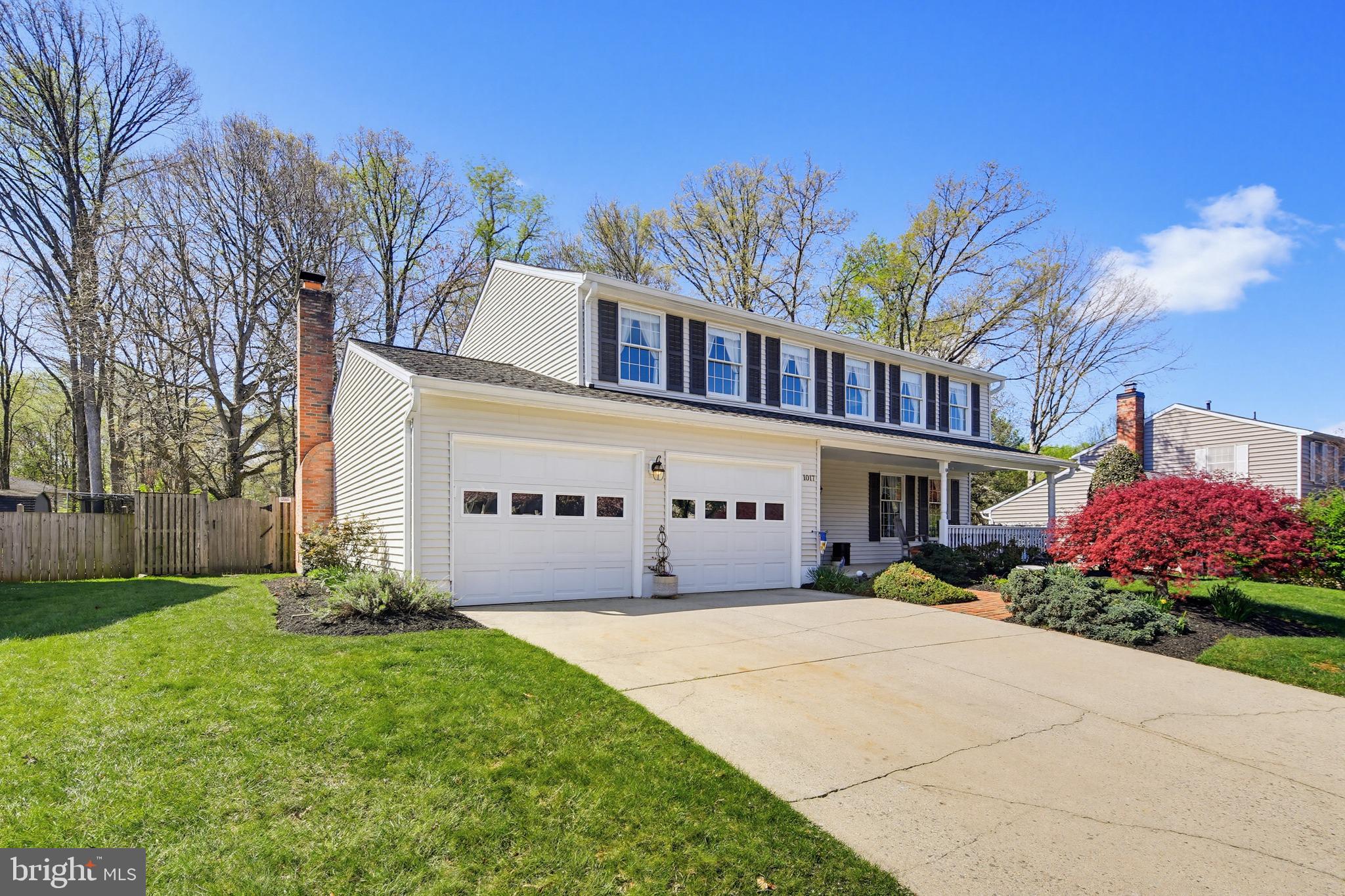 1017 Windmill Lane Silver Spring, MD 20905 - Photo 4 of 57 a front view of a house with a yard and garage