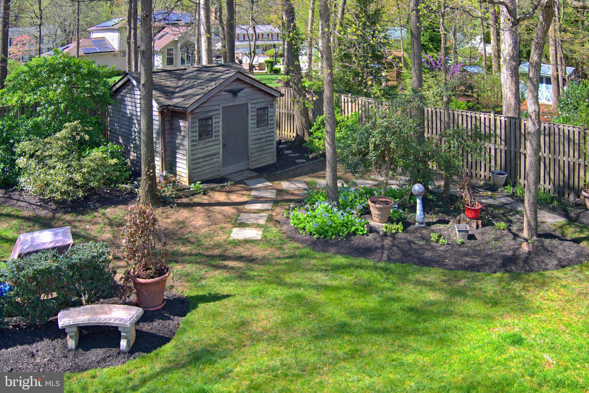 1017 Windmill Lane Silver Spring, MD 20905 - Photo 47 of 57 a view of a house with a backyard and sitting area