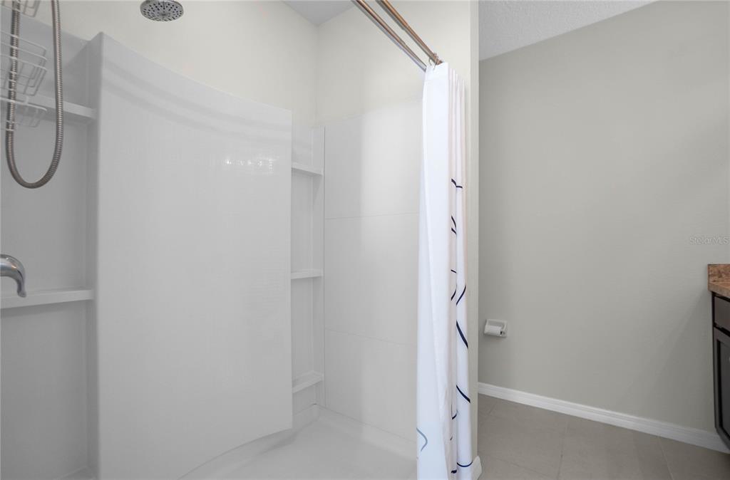 3525 North Burroughs Path Beverly Hills, FL 34465 - Photo 16 of 49 a bathroom with a glass shower door