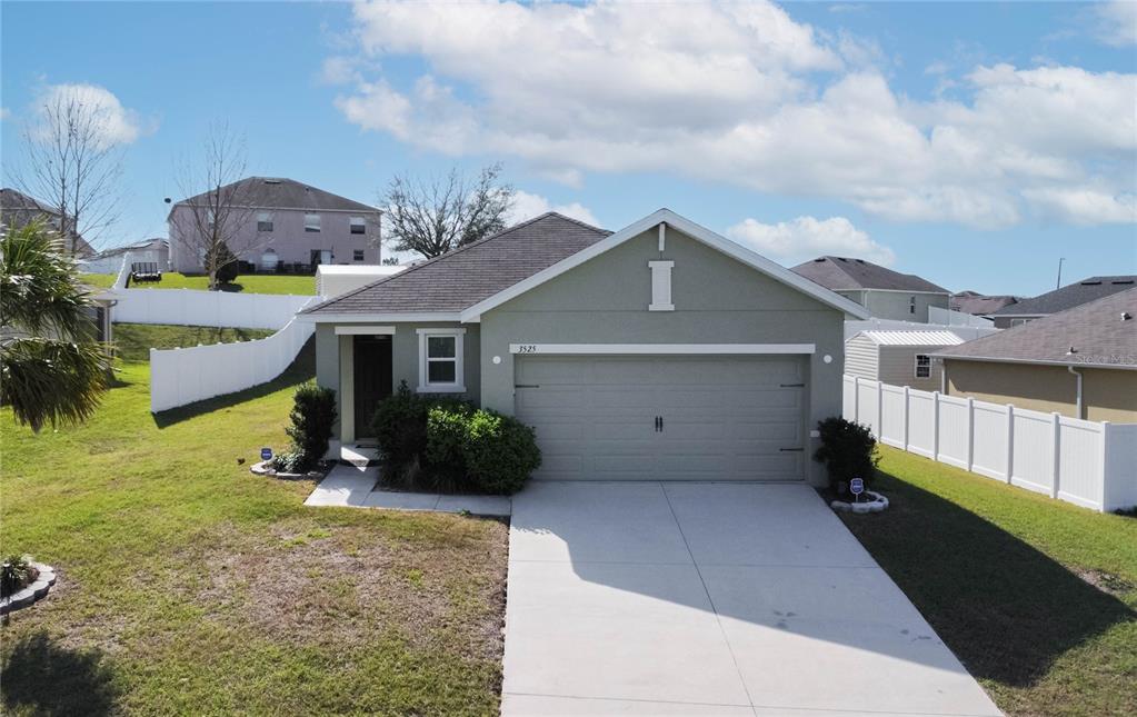 3525 North Burroughs Path Beverly Hills, FL 34465 - Photo 2 of 49 a front view of a house with garden