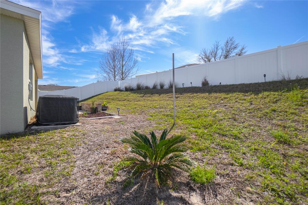 3525 North Burroughs Path Beverly Hills, FL 34465 - Photo 31 of 49 a view of a house with a yard