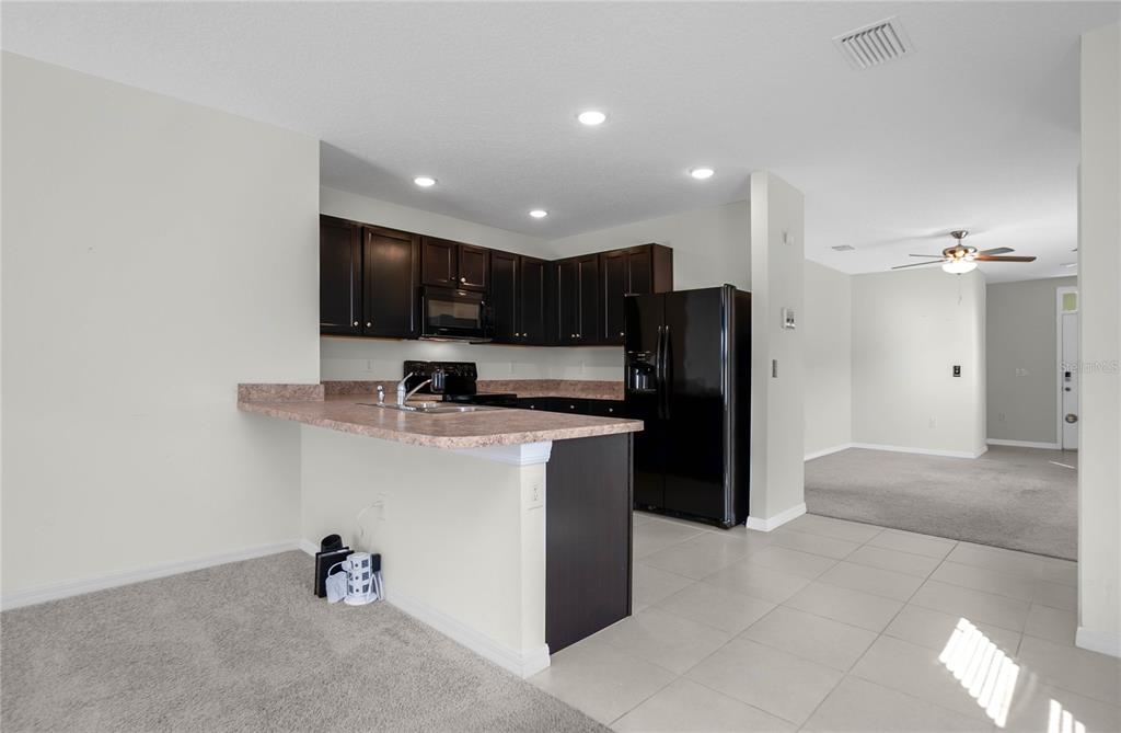 3525 North Burroughs Path Beverly Hills, FL 34465 - Photo 4 of 49 a kitchen with stainless steel appliances granite countertop a refrigerator and a sink
