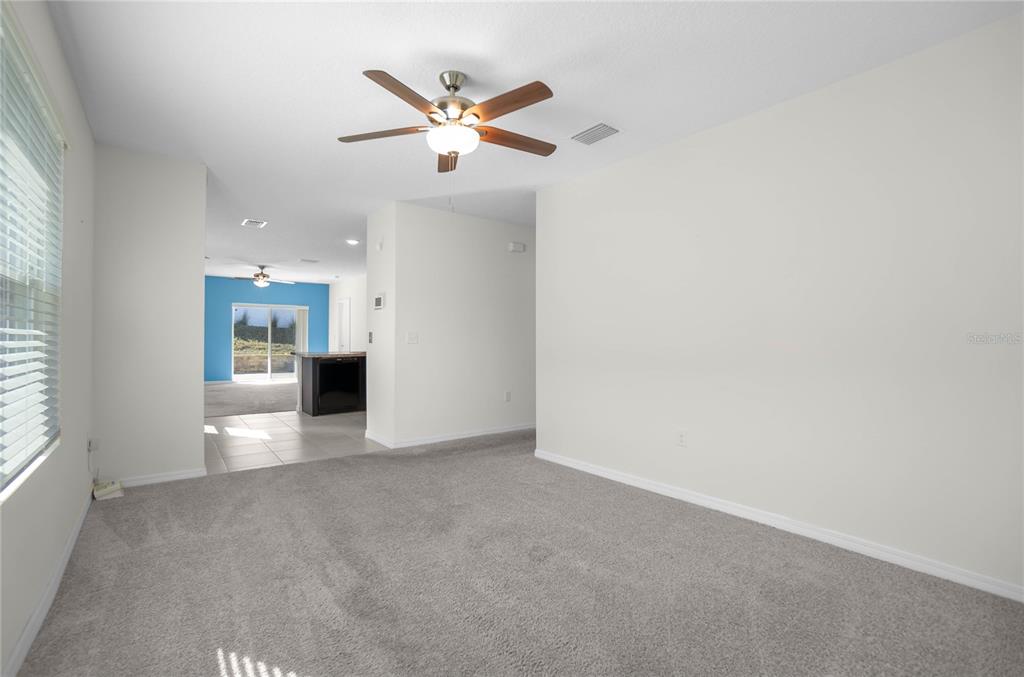 3525 North Burroughs Path Beverly Hills, FL 34465 - Photo 6 of 49 a view of a livingroom with a ceiling fan and window