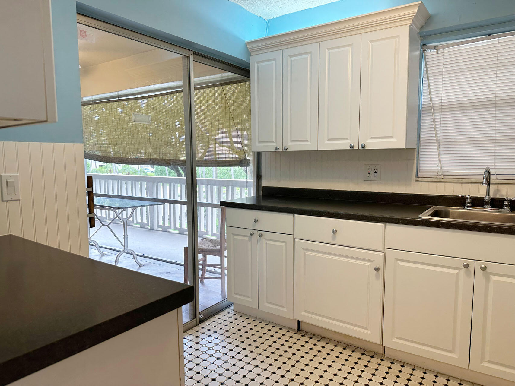 100 Royal Palm Way, Unit 2010 Boca Raton, FL 33432 - Photo 11 of 31 a kitchen with a white cabinets and a window