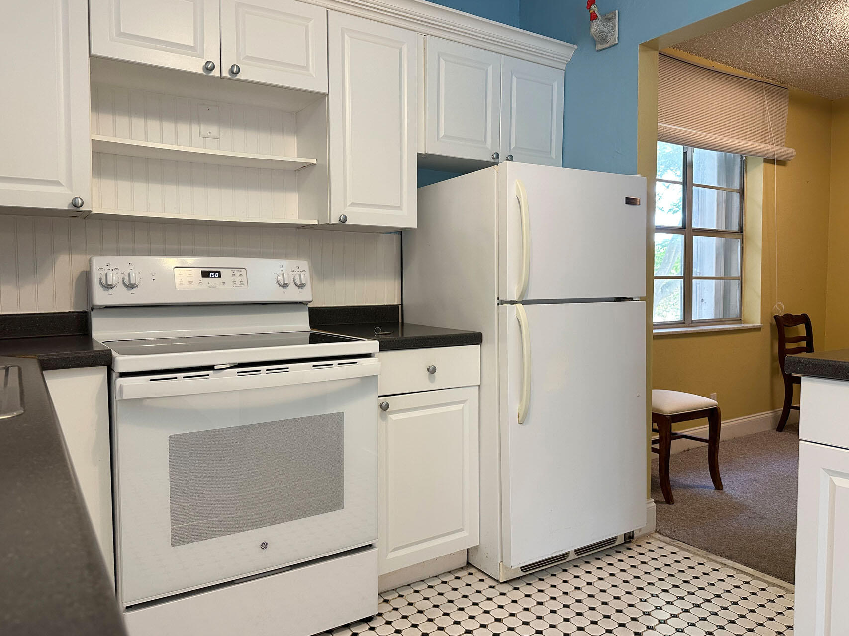 100 Royal Palm Way, Unit 2010 Boca Raton, FL 33432 - Photo 15 of 31 a white refrigerator freezer and a stove sitting inside of a kitchen