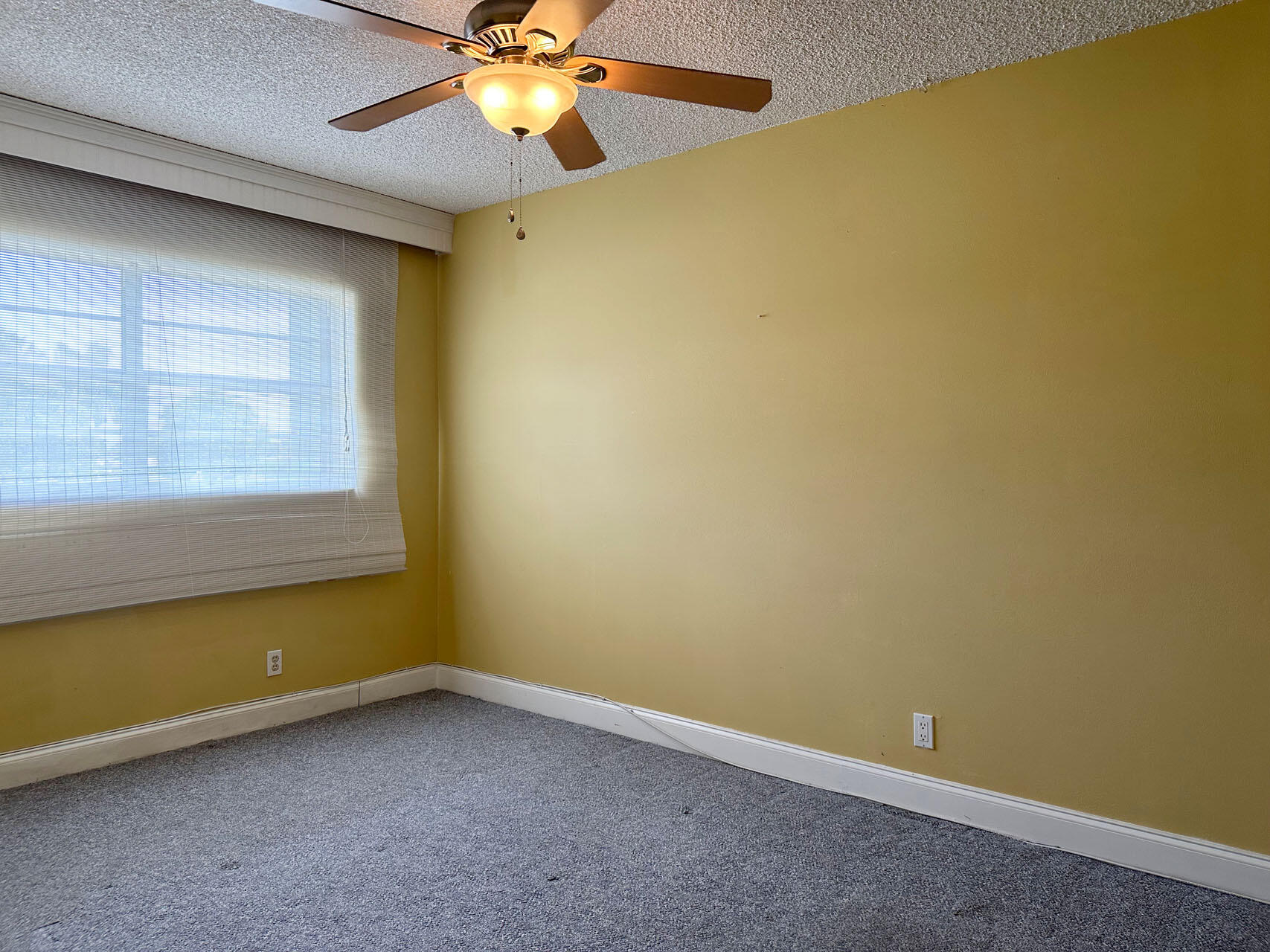 100 Royal Palm Way, Unit 2010 Boca Raton, FL 33432 - Photo 24 of 31 an empty room with a window and a ceiling fan